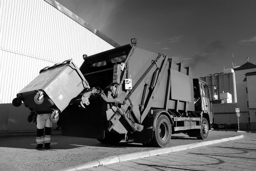 Waste removal team preparing to load a van at a commercial site in Twickenham