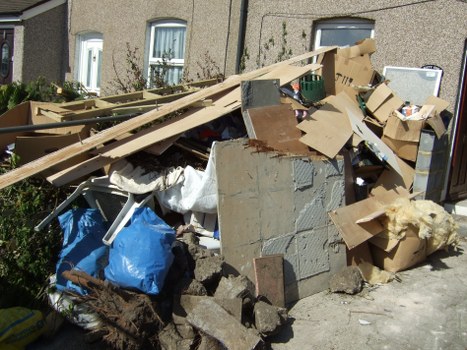 Happy homeowner after garage clearance in Twickenham